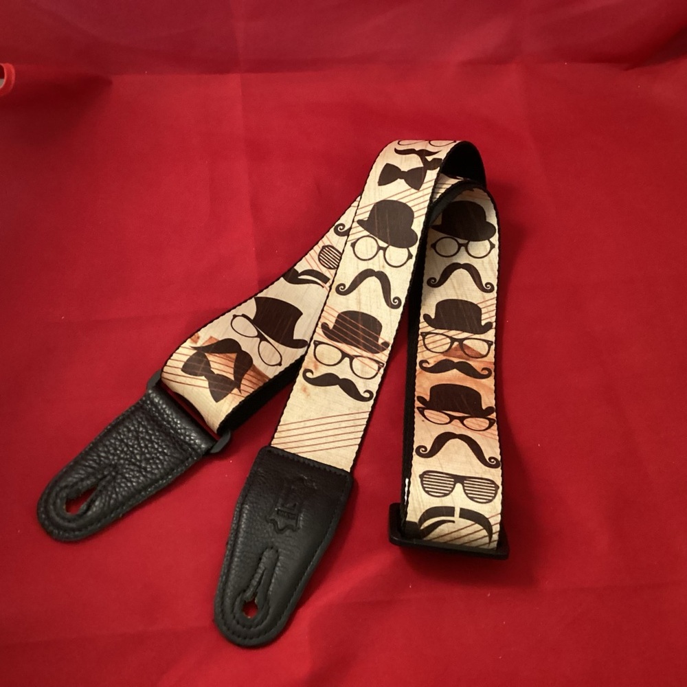 Levy’s mustache glasses hat pattern guitar strap